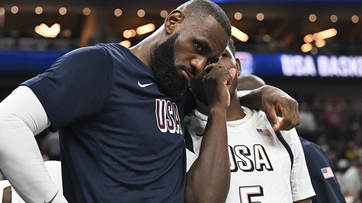 USA forward Lebron James (6) and guard Anthony Edwards (5) speak on the bench in the fourth quarter against Canada in the USA Basketball Showcase