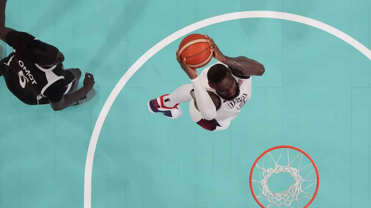 United States guard Lebron James (6) dunks against South Sudan small forward Nuni Omot (5) in the fourth quarter during the Paris 2024 Olympic Summer Games at Stade Pierre-Mauroy.