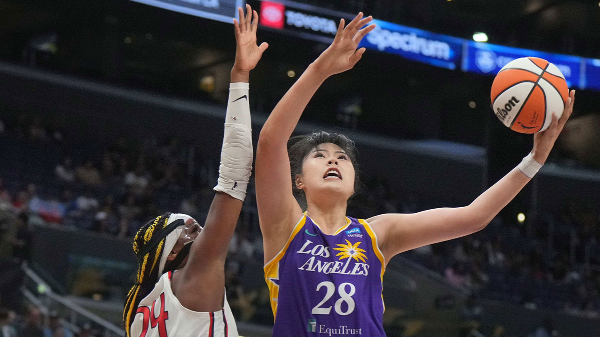 LA Sparks center Li Yueru (28) shoots the ball against Washington Mystics forward Aaliyah Edwards (24) in the first half at Crypto.com Arena. 