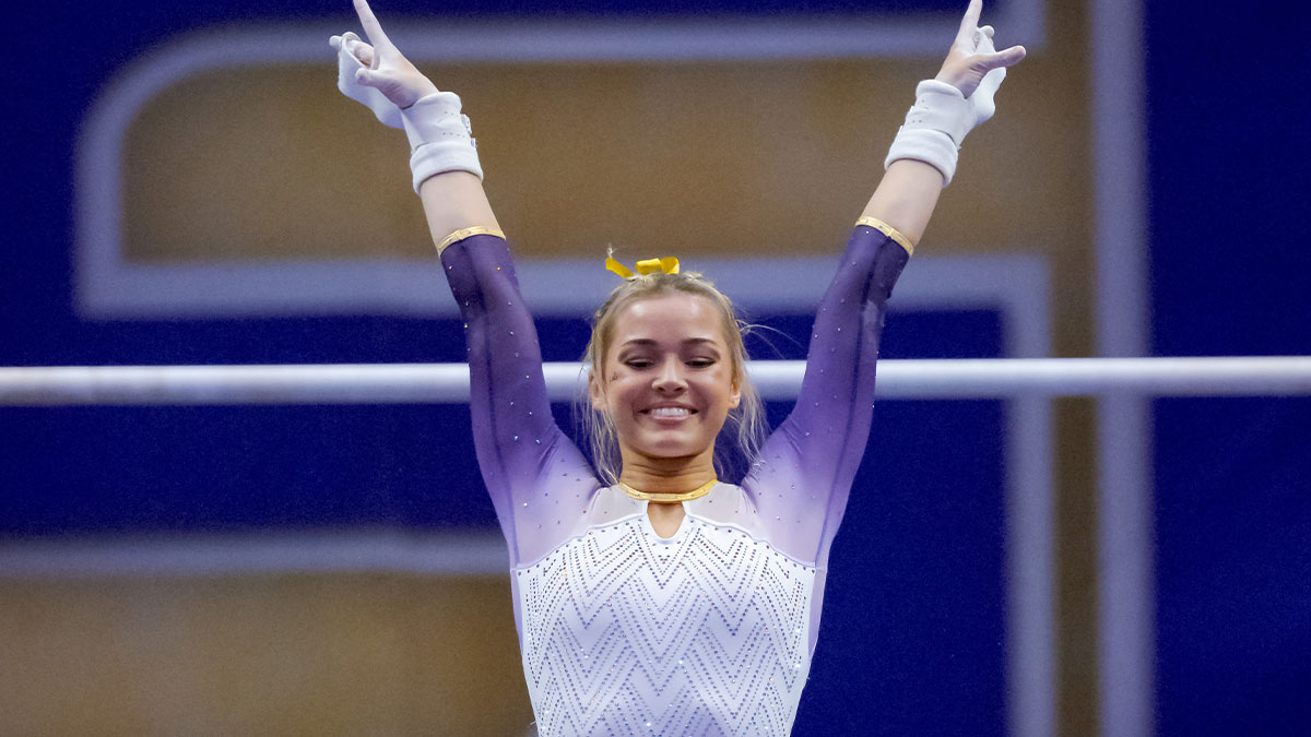 LSU Lady Tigers senior Olivia \"Livvy\" Dunne performs a demonstration uneven bars routine against the Arkansas Razorbacks at Pete Maravich Assembly Center.