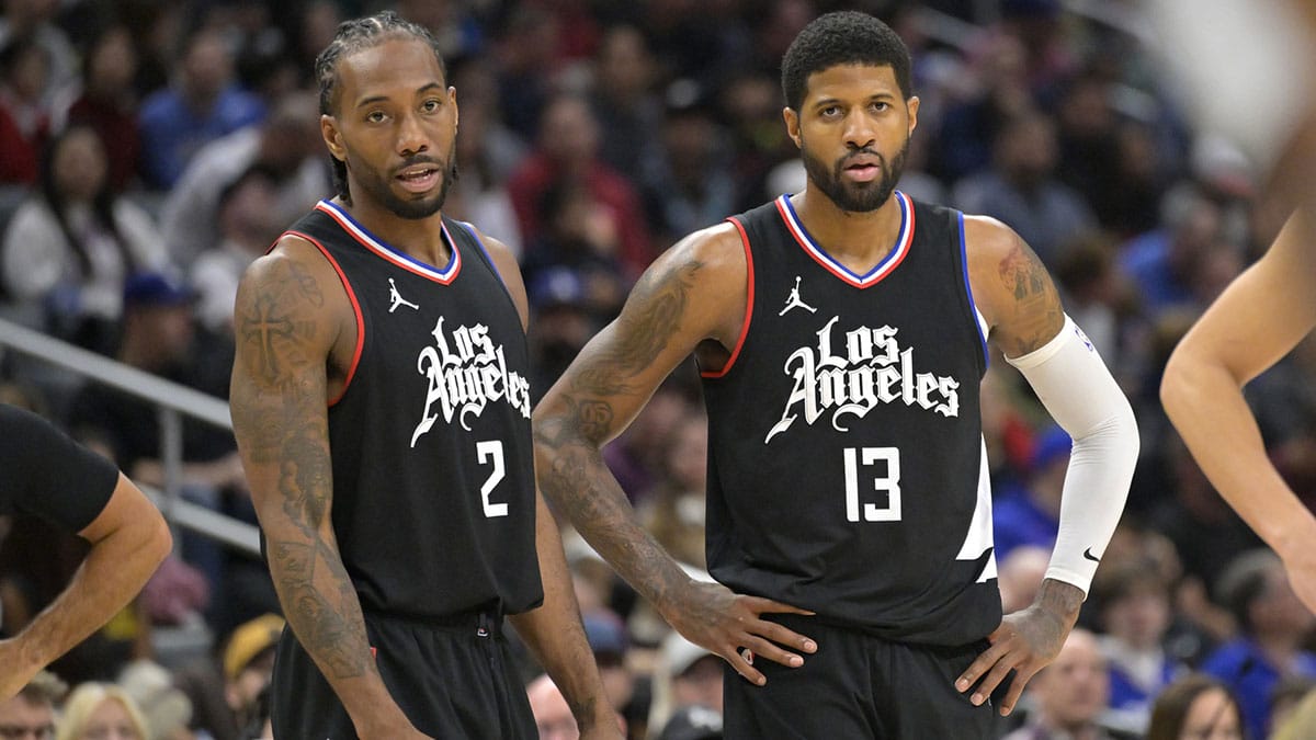 Feb 10, 2024; Los Angeles, California, USA; Los Angeles Clippers forward Kawhi Leonard (2) and forward Paul George (13) look on in the second half against the Detroit Pistons at Crypto.com Arena. Mandatory Credit: Jayne Kamin-Oncea-USA TODAY Sports