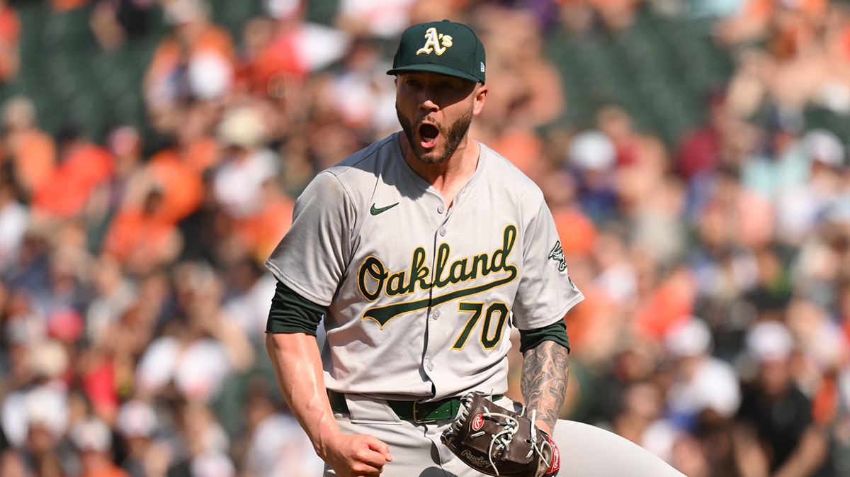 Oakland Athletics relief pitcher Lucas Erceg (70) reacts to a strikeout to end the game during the ninth inning against the Oakland Athletics at Oriole Park at Camden Yards.