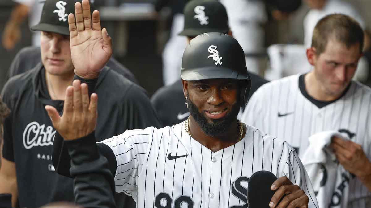 Chicago White Sox outfielder Luis Robert Jr. (88) celebrates with teammates after scoring against the Los Angeles Dodgers during the first inning at Guaranteed Rate Field.
