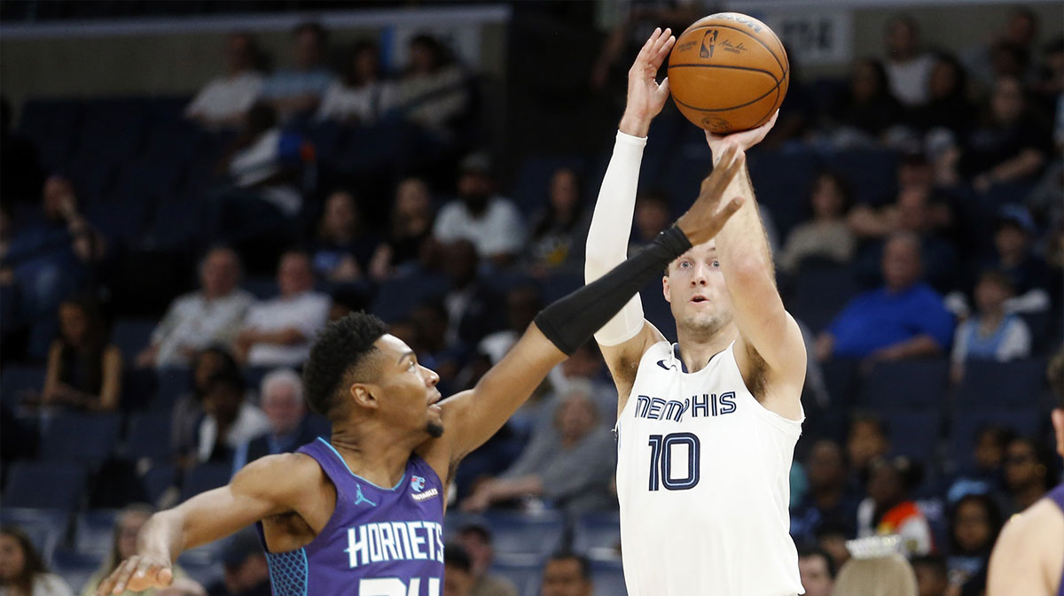 Memphis Grizzlies guard Luke Kennard (10) shoots the ball as Charlotte Hornets forward Brandon Miller (24) defends during the first half at FedExForum. 