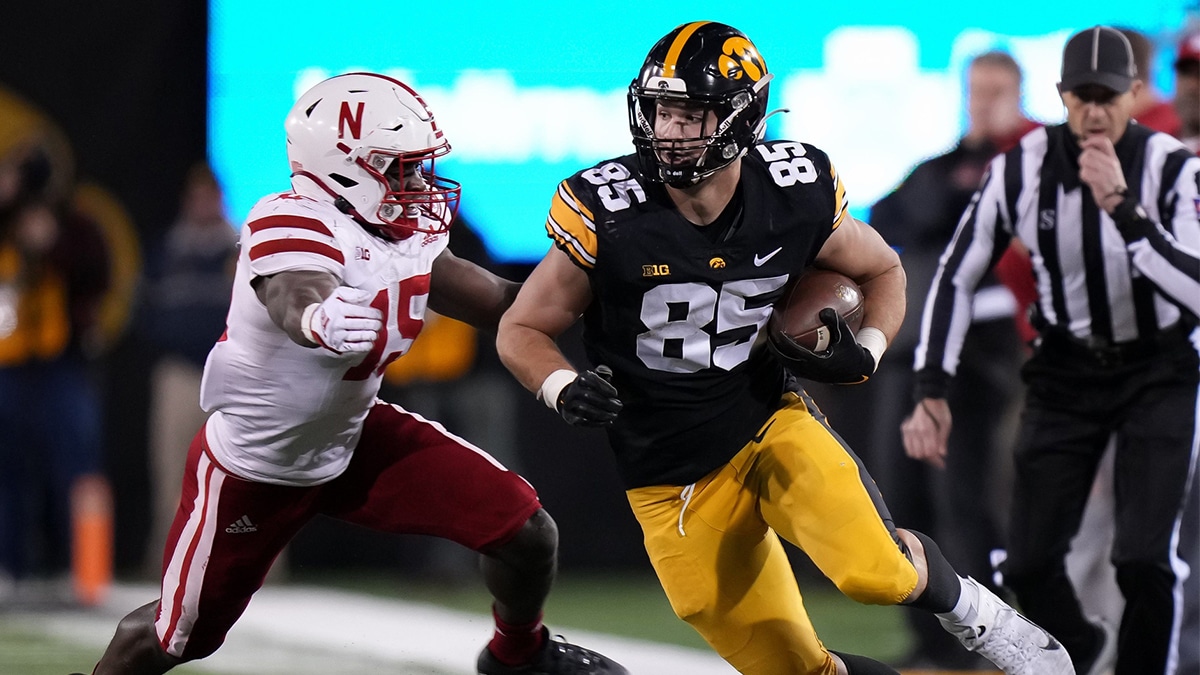 Iowa tight end Luke Lachey runs the ball after making a reception in the third quarter against Nebraska during a NCAA football game on Friday, Nov. 25, 2022, at Kinnick Stadium in Iowa City.