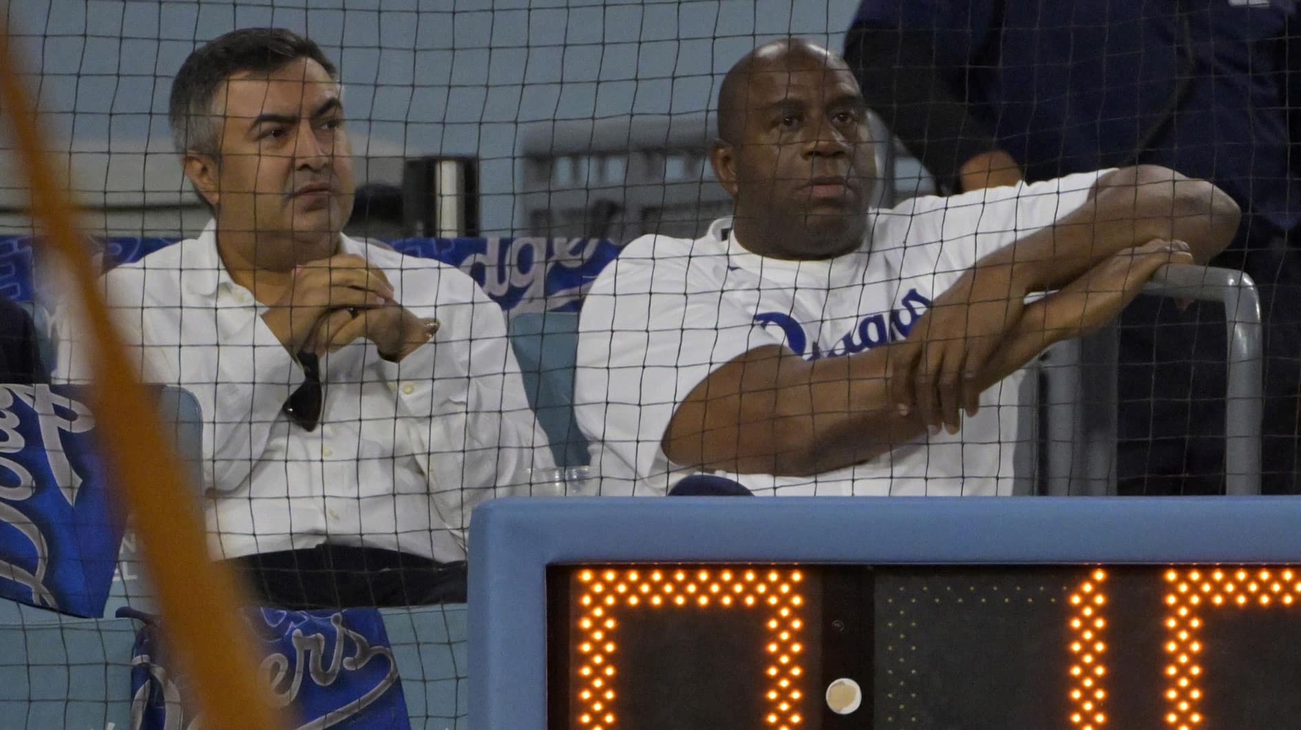 Magic Johnson watches the game during the second inning for game two of the NLDS for the 2023 MLB playoffs between the Los Angeles Dodgers and Arizona Diamondbacksa at Dodger Stadium. 