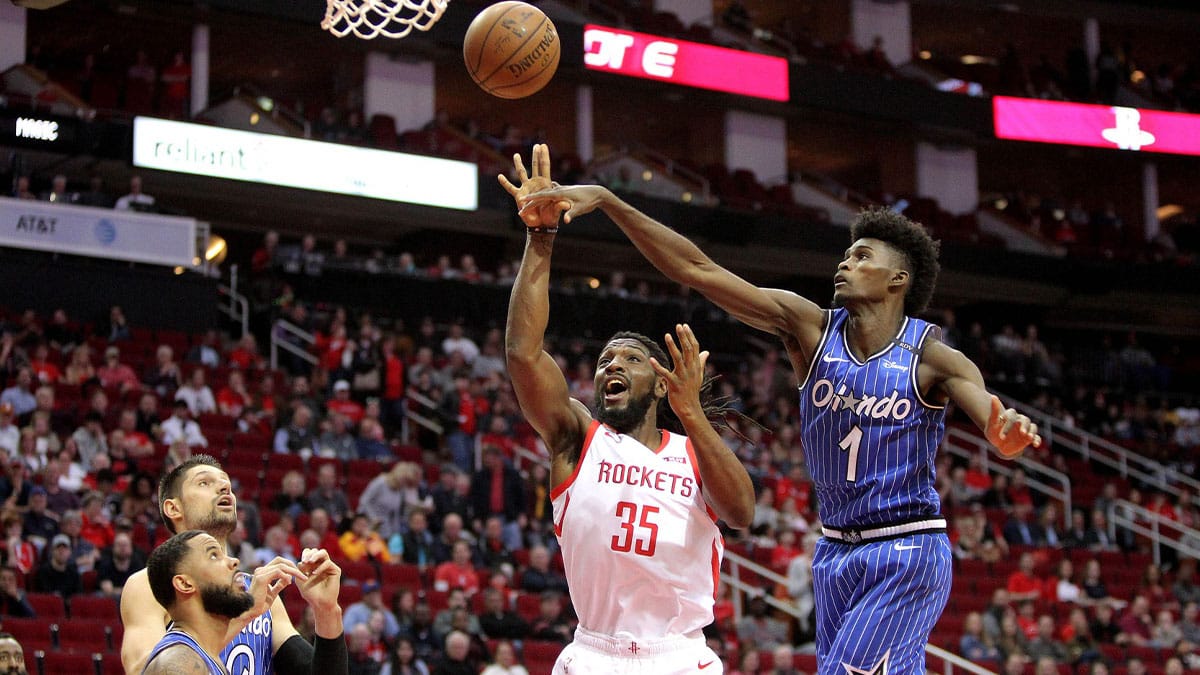 Orlando Magic forward Jonathan Issac (1) blocks a shot attempt by Houston Rockets center Kenneth Faried (35) during the first quarter at Toyota Center. 