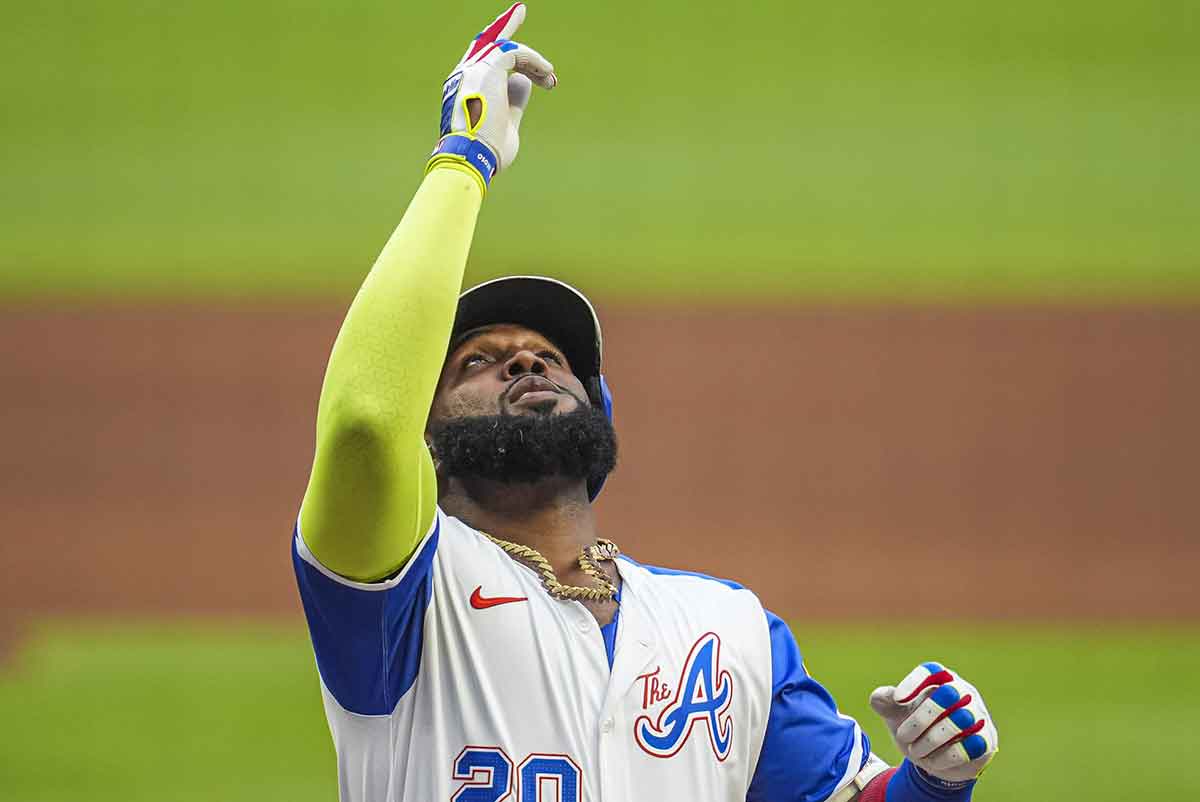 Atlanta Braves designated hitter Marcell Ozuna (20) reacts after hitting a home run against the Philadelphia Phillies during the first inning at Truist Park. 