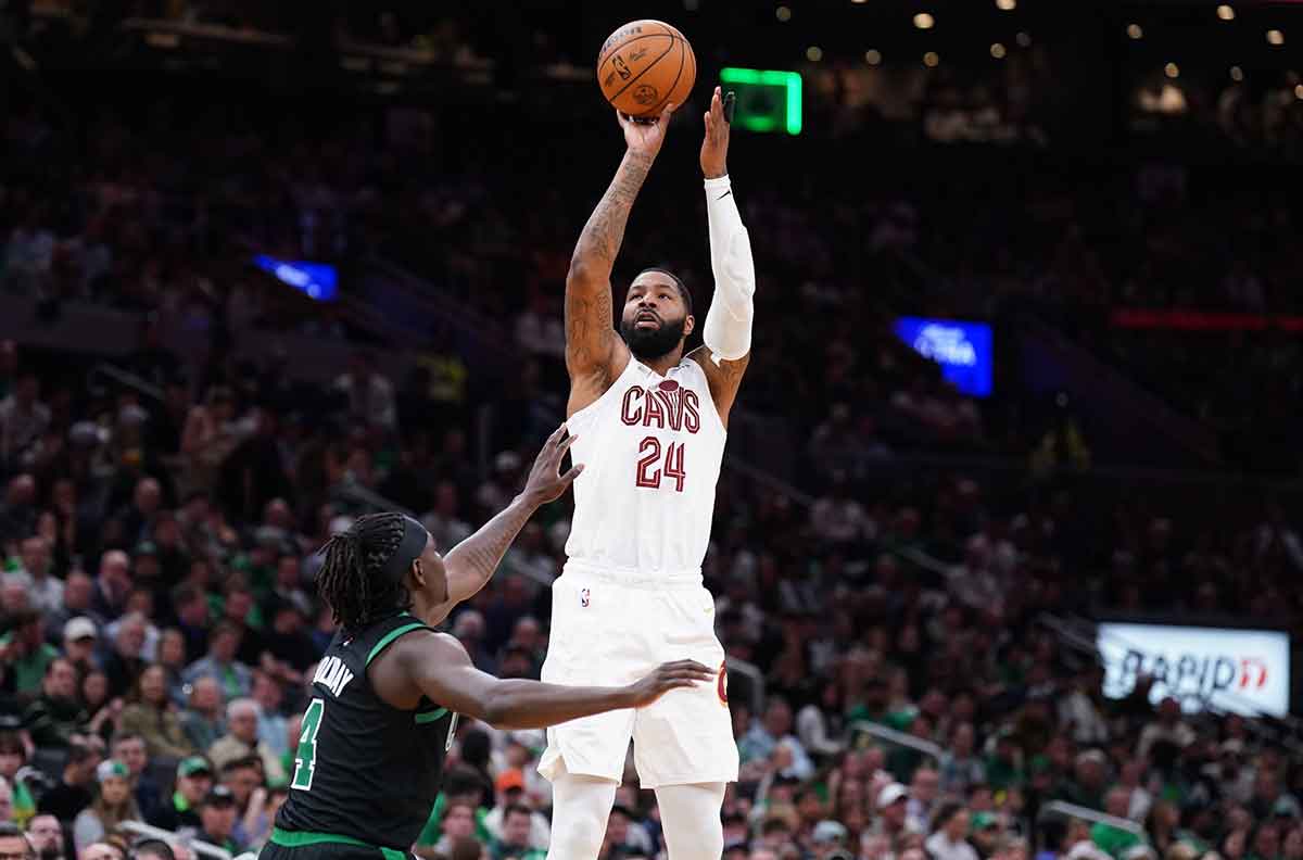 Cleveland Cavaliers forward Marcus Morris Sr. (24) shoots against Boston Celtics guard Jrue Holiday (4) in the second quarter during game five of the second round for the 2024 NBA playoffs at TD Garden.