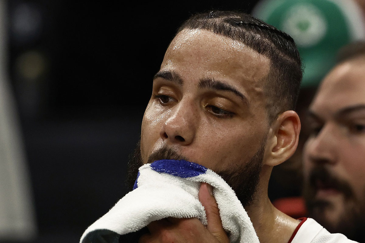 Miami Heat forward Caleb Martin (16) wipes sweat from his face during the fourth quarter of game five of the first round of the 2024 NBA playoffs against the Boston Celtics at TD Garden.