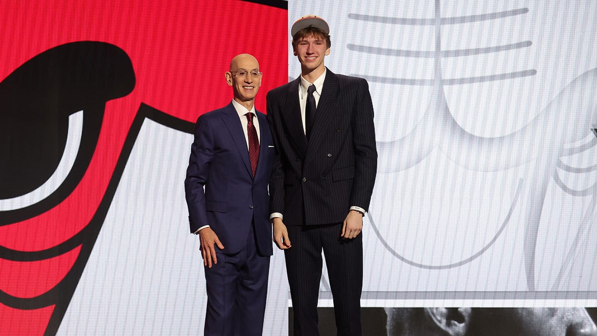 Matas Buzelis poses for photos with NBA commissioner Adam Silver after being selected in the first round by the Chicago Bulls in the 2024 NBA Draft at Barclays Center.