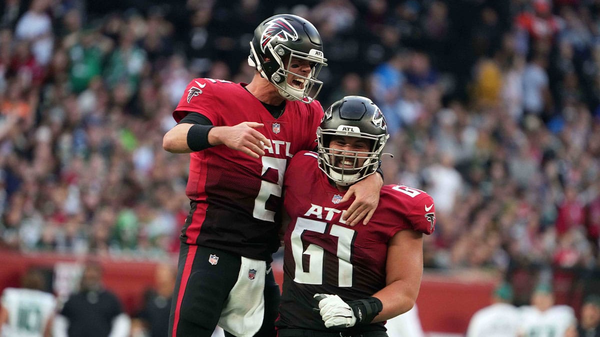 Atlanta Falcons quarterback Matt Ryan (2) and center Matt Hennessy (61) celebrate after a touchdown in the fourth quarter against the New York Jets during an NFL International Series aame at Tottenham Hotspur Stadium. The Falcons defeated the Jets 27-20.