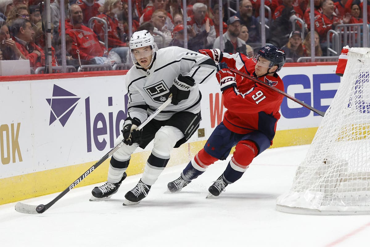 Los Angeles Kings defenseman Matt Roy (3) skates with the puck as Washington Capitals center Joe Snively (91) in the third period at Capital One Arena.