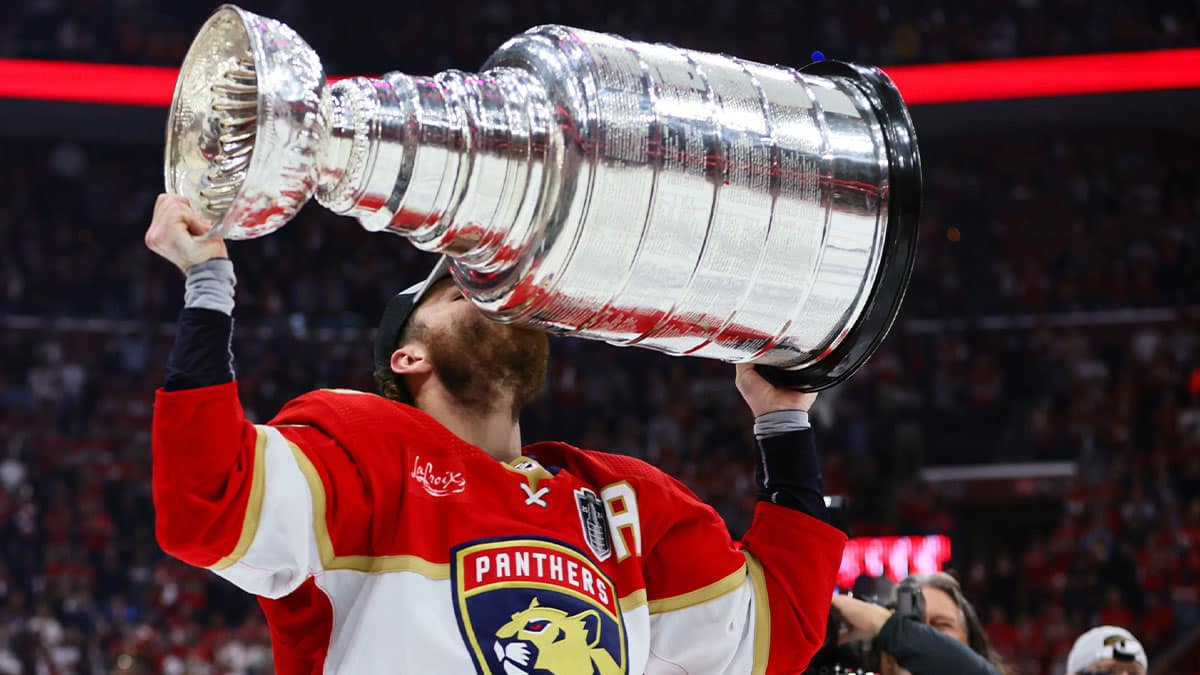 Florida Panthers left wing Matthew Tkachuk (19) kisses the cup after winning game seven of the 2024 Stanley Cup Final against the Edmonton Oilers at Amerant Bank Arena.
