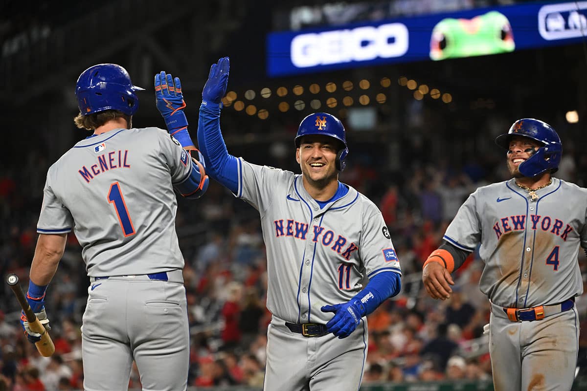 New York Mets second baseman Jose Iglesias (11) celebrates with second baseman Jeff McNeil (1) after hitting a home run against the Washington Nationals during the tenth inning at Nationals Park.