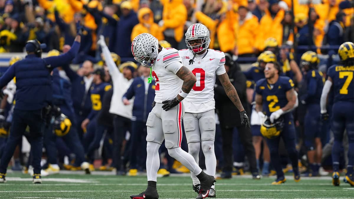 After a Michigan Wolverines interception all but ended the game, Ohio State Buckeyes wide receiver Emeka Egbuka (2) and wide receiver Xavier Johnson (0) walk off the field in the final seconds of the second half of the NCAA football game at Michigan Stadium. Ohio State lost 30-24.