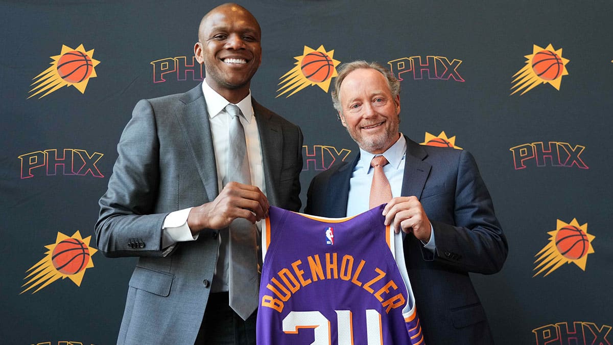 Mike Budenholzer poses alongside General Manager James Jones during a press conference to announce his job as head coach of the Phoenix Suns