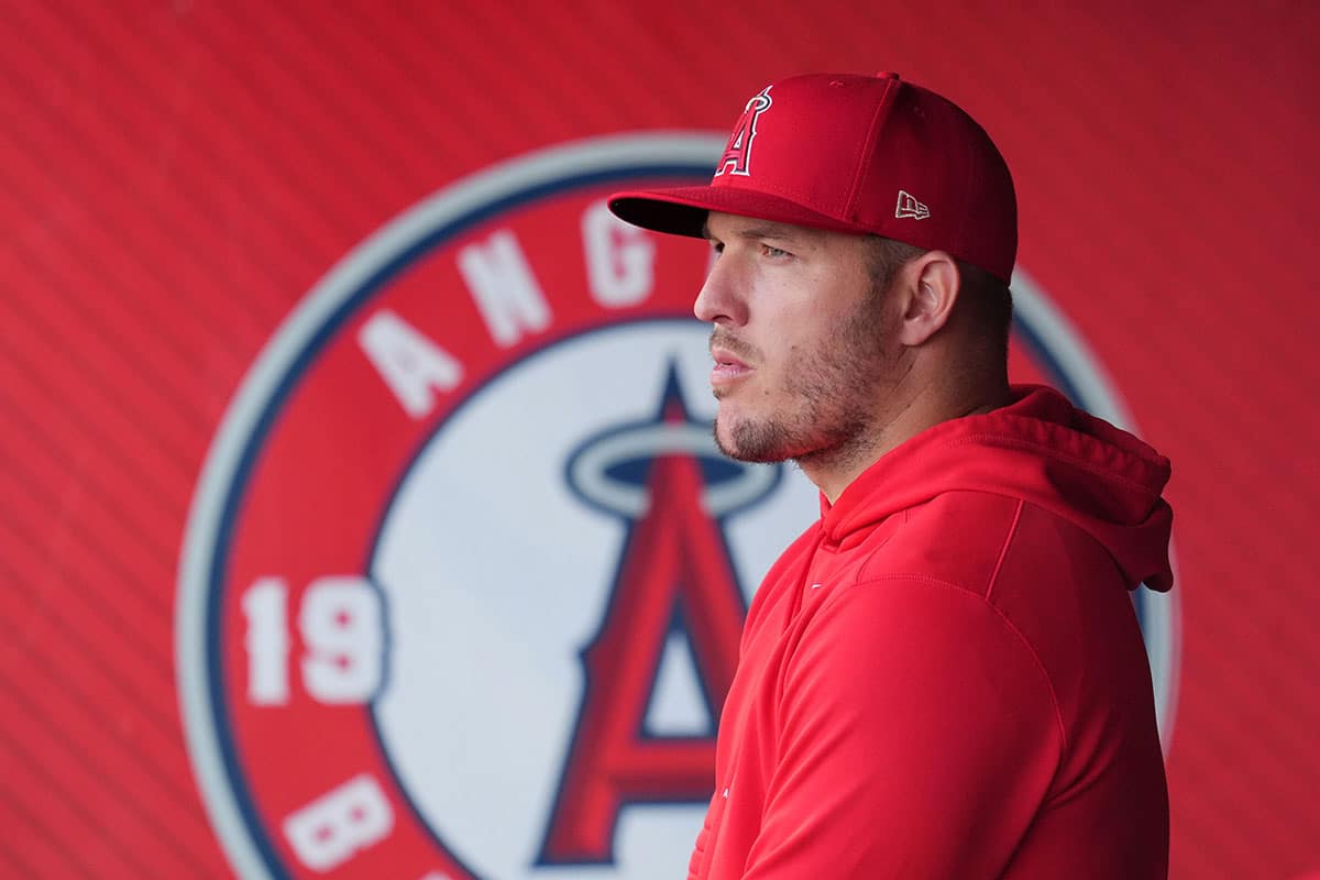 Los Angeles Angels center fielder Mike Trout watches from the dugout during a game against the Texas Rangers at Angel Stadium.