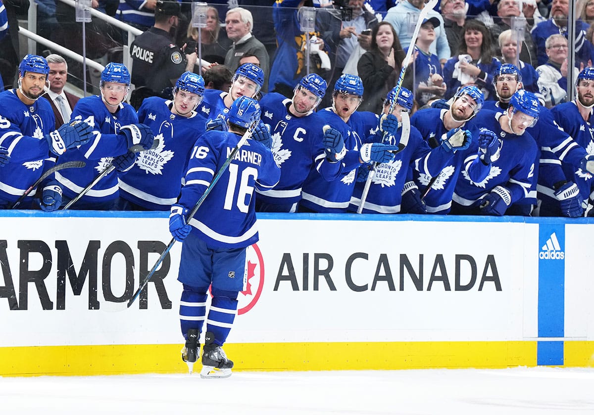 Toronto Maple Leafs right wing Mitch Marner (16) celebrates at the bench after scoring a goal against the Boston Bruins during the third period in game four of the first round of the 2024 Stanley Cup Playoffs at Scotiabank Arena.