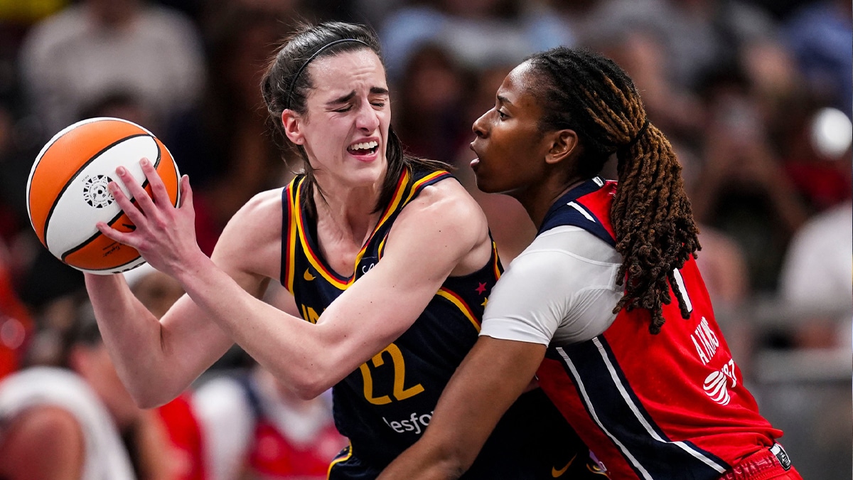 Washington Mystics guard Ariel Atkins (7) guards Indiana Fever guard Caitlin Clark (22) Wednesday, July 10, 2024, during the game at Gainbridge Fieldhouse in Indianapolis.
