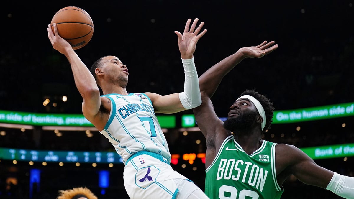 Boston Celtics center Neemias Queta (88) defends against Charlotte Hornets guard Bryce McGowens (7) in the second half at TD Garden. 