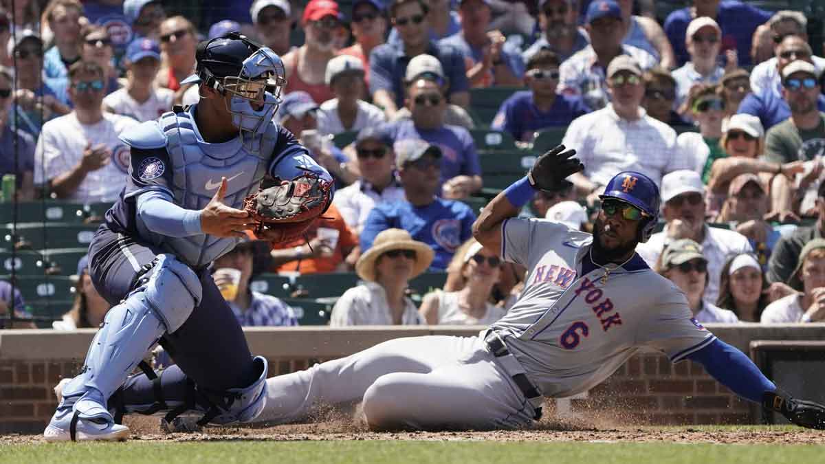 Jun 21, 2024; Chicago, Illinois, USA; New York Mets outfielder Starling Marte (6) is safe at home plate as Chicago Cubs catcher Miguel Amaya (9) makes a late tag during the fourth inning at Wrigley Field. Mandatory Credit: David Banks-USA TODAY SportsJun 21, 2024; Chicago, Illinois, USA; New York Mets outfielder Starling Marte (6) is safe at home plate as Chicago Cubs catcher Miguel Amaya (9) makes a late tag during the fourth inning at Wrigley Field. Mandatory Credit: David Banks-USA TODAY Sports