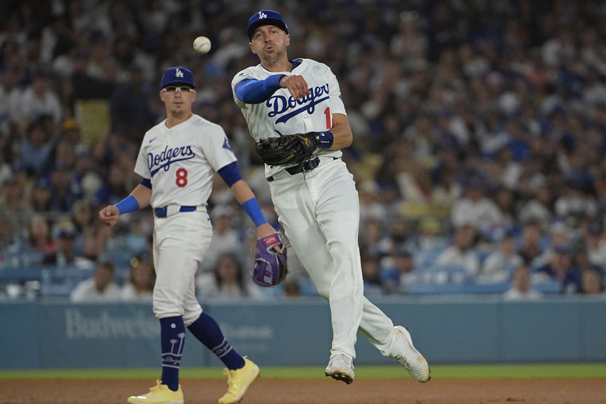 Los Angeles Dodgers shortstop Nick Ahmed (12) throws San Francisco Giants designated hitter Jorge Soler (2) out at first in the eighth inning at Dodger Stadium