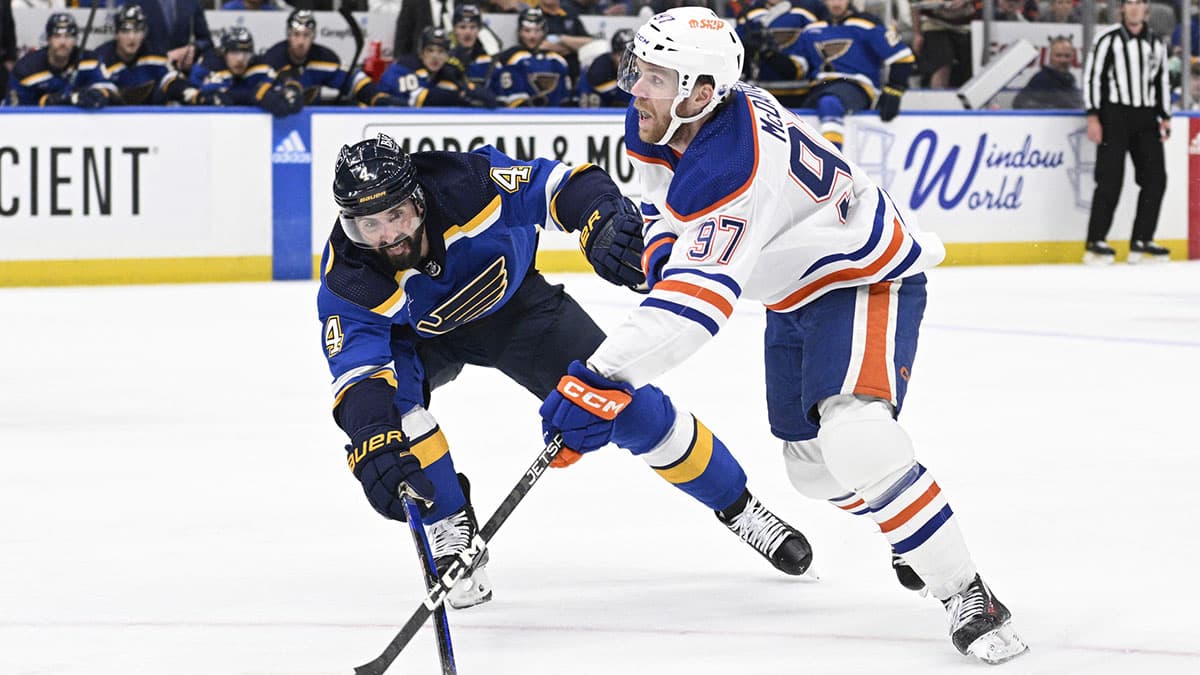 St. Louis Blues defenseman Nick Leddy (4) attempts to block a shot from Edmonton Oilers center Connor McDavid (97) during the third period at Enterprise Center.