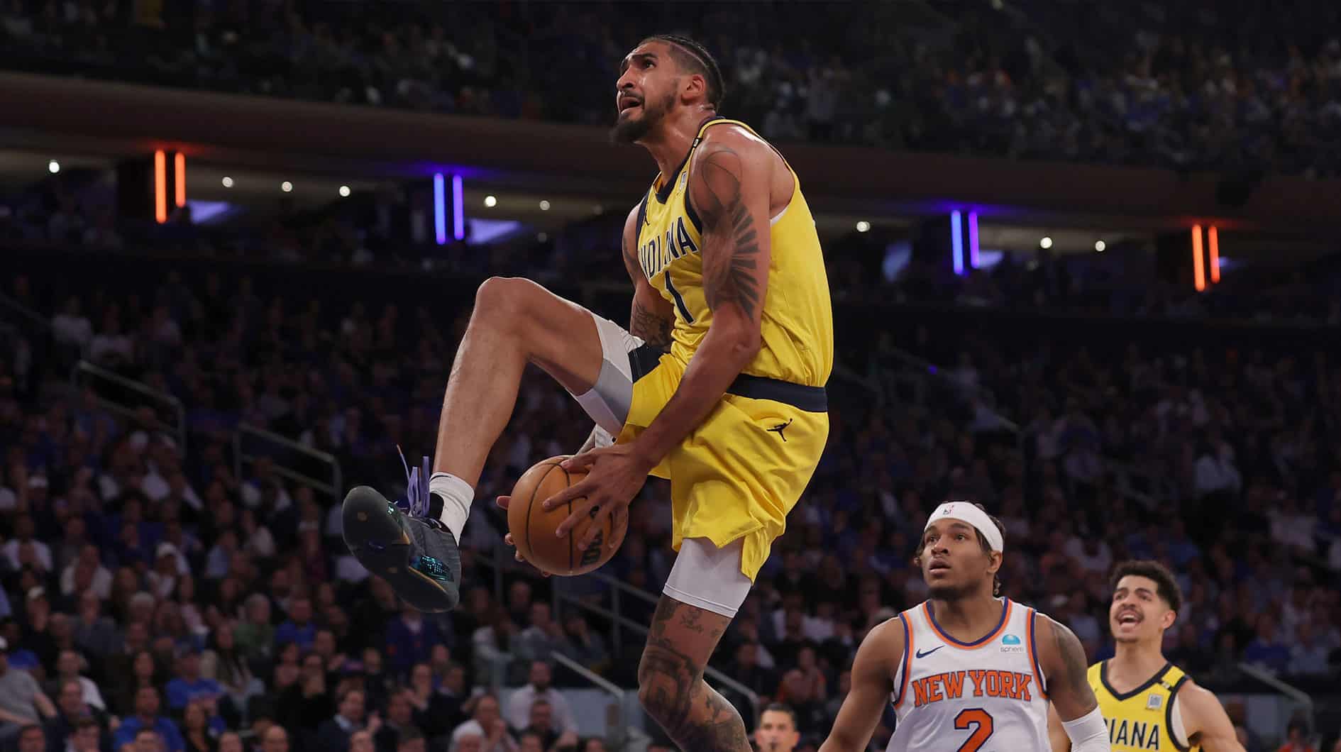 Indiana Pacers forward Obi Toppin (1) dunks against New York Knicks guard Miles McBride (2) during the third quarter of game one of the second round of the 2024 NBA playoffs at Madison Square Garden.