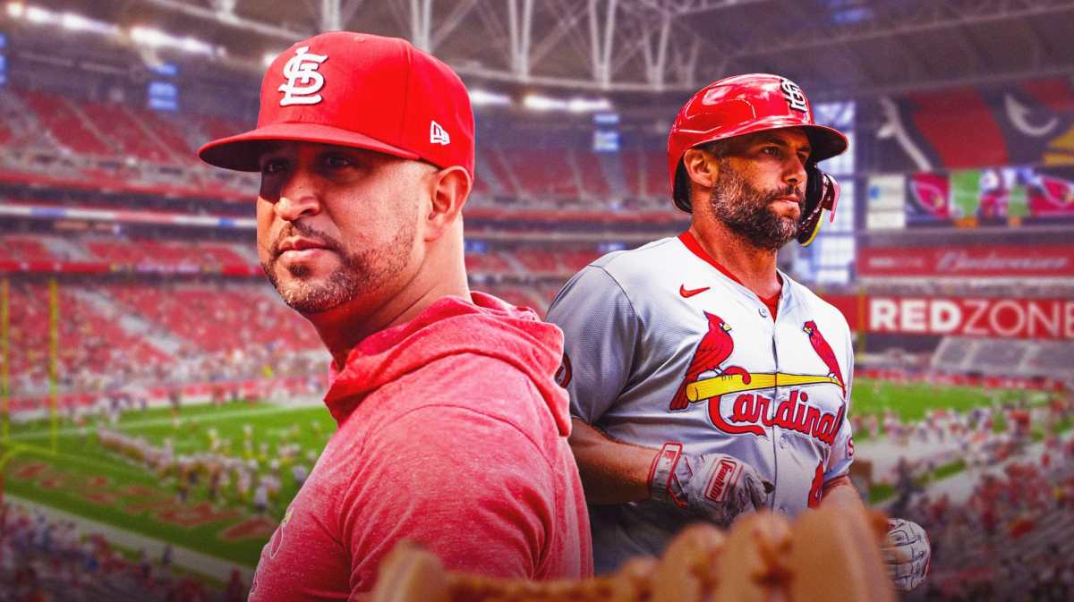 Cardinals' Oli Marmol on the left, with Paul Goldschmidt on the right.