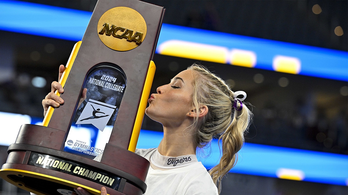 LSU Tigers gymnast Olivia Dunne kisses the trophy after the LSU Tigers gymnastics team wins the national championship in the 2024 Womens National Gymnastics Championship at Dickies Arena. 