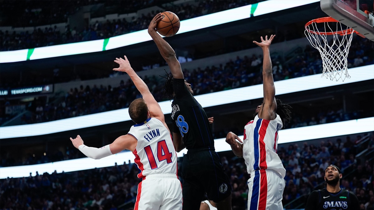 Dallas Mavericks forward Olivier-Maxence Prosper (18) dunks the ball against Detroit Pistons center James Wiseman (13) during the first half at American Airlines Center. 