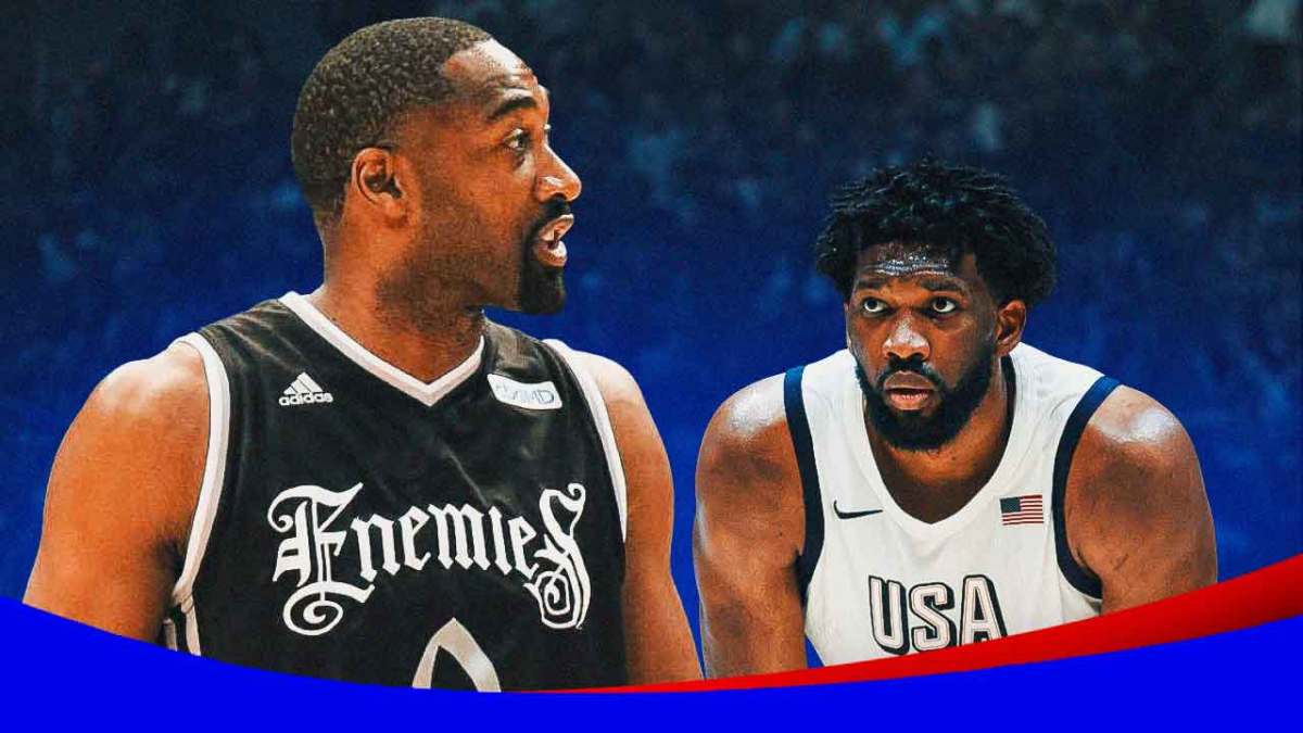 Joel Embiid wearing Team USA jersey facing Gilbert Arenas both are looking serious.
