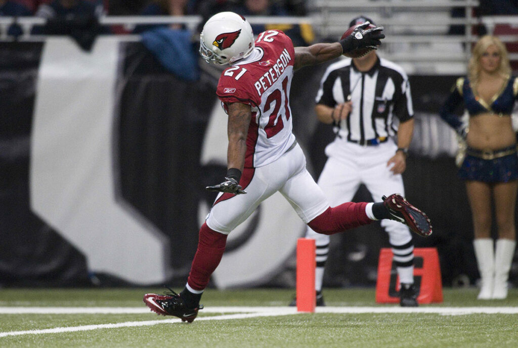 Arizona Cardinals cornerback Patrick Peterson (21) celebrates as he returns a 80 yard punt for a touchdown in the second half against the St. Louis Rams at the Edward Jones Dome. 