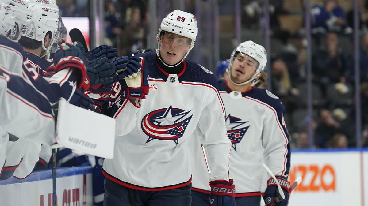 Columbus Blue Jackets forward Patrik Laine (29) gets congratulated after scoring against the Toronto Maple Leafs during the first period at Scotiabank Arena.