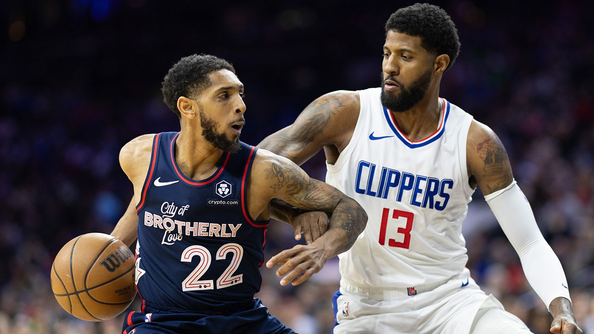 Philadelphia 76ers guard Cameron Payne (22) drives against LA Clippers forward Paul George (13) during the second quarter at Wells Fargo Center.