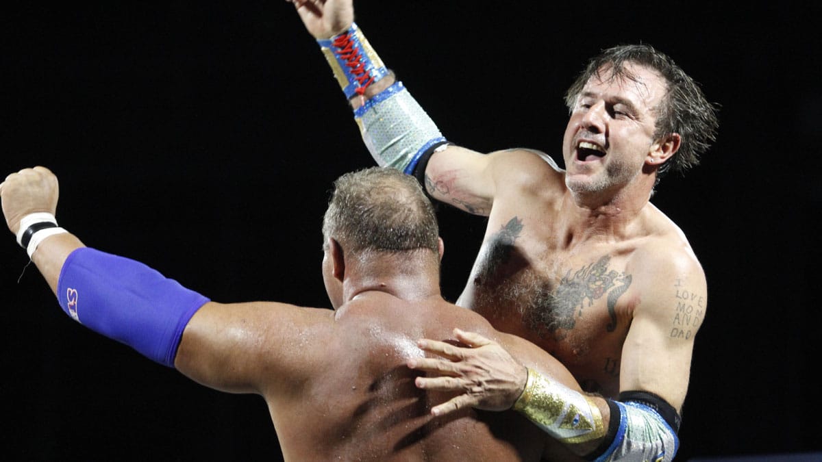 Perfect Storm and David Arquette celebrating their National Wrestling Alliance Pop-Up Event win in 2019.