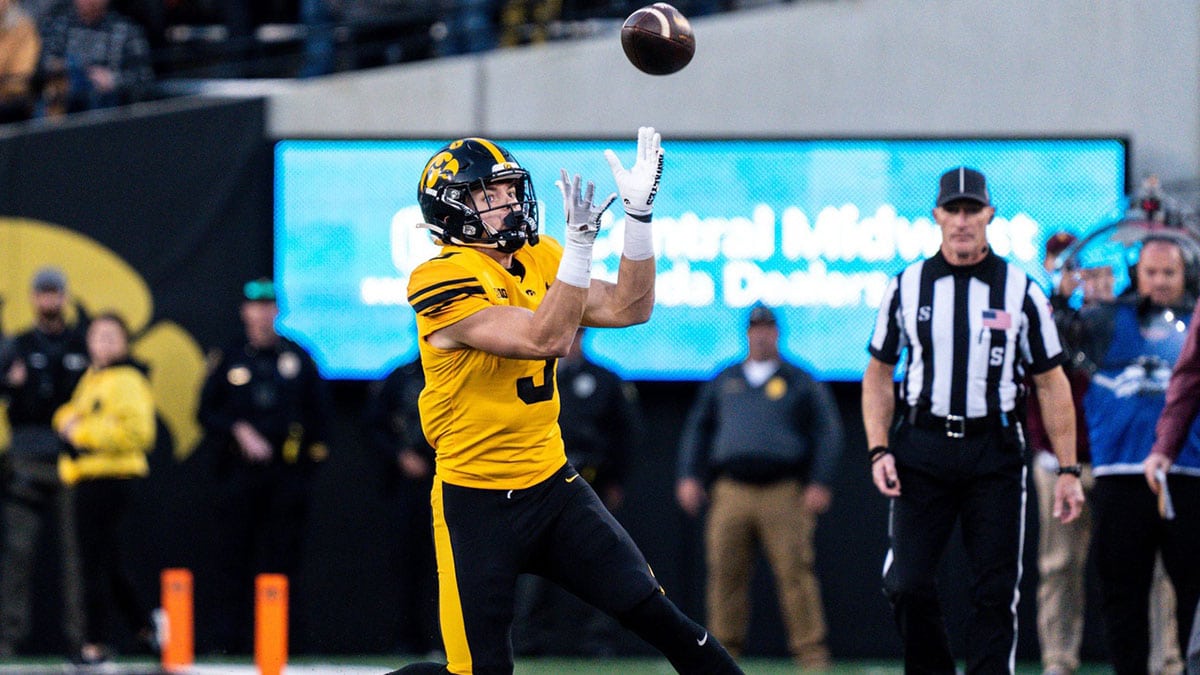 Iowa defensive back Cooper DeJean (3) catches a punt at Kinnick Stadium. DeJean returned the punt for a touchdown and it was later called back after review ruled he fair-caught the punt.