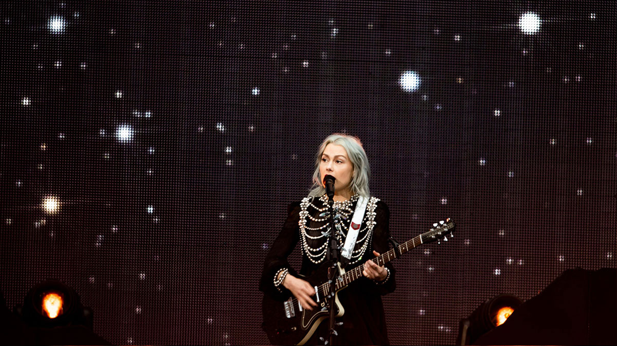 Phoebe Bridgers performing in Nashville, Tennessee, while opening for Taylor Swift.