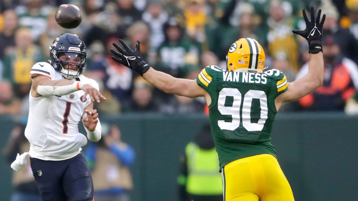 Chicago Bears quarterback Justin Fields (1) throwns under pressure from Green Bay Packers linebacker Lukas Van Ness (90) during their football game Sunday, January 7, 2024, at Lambeau Field in Green Bay, Wis. The Packers defeated the Bears 17-9.