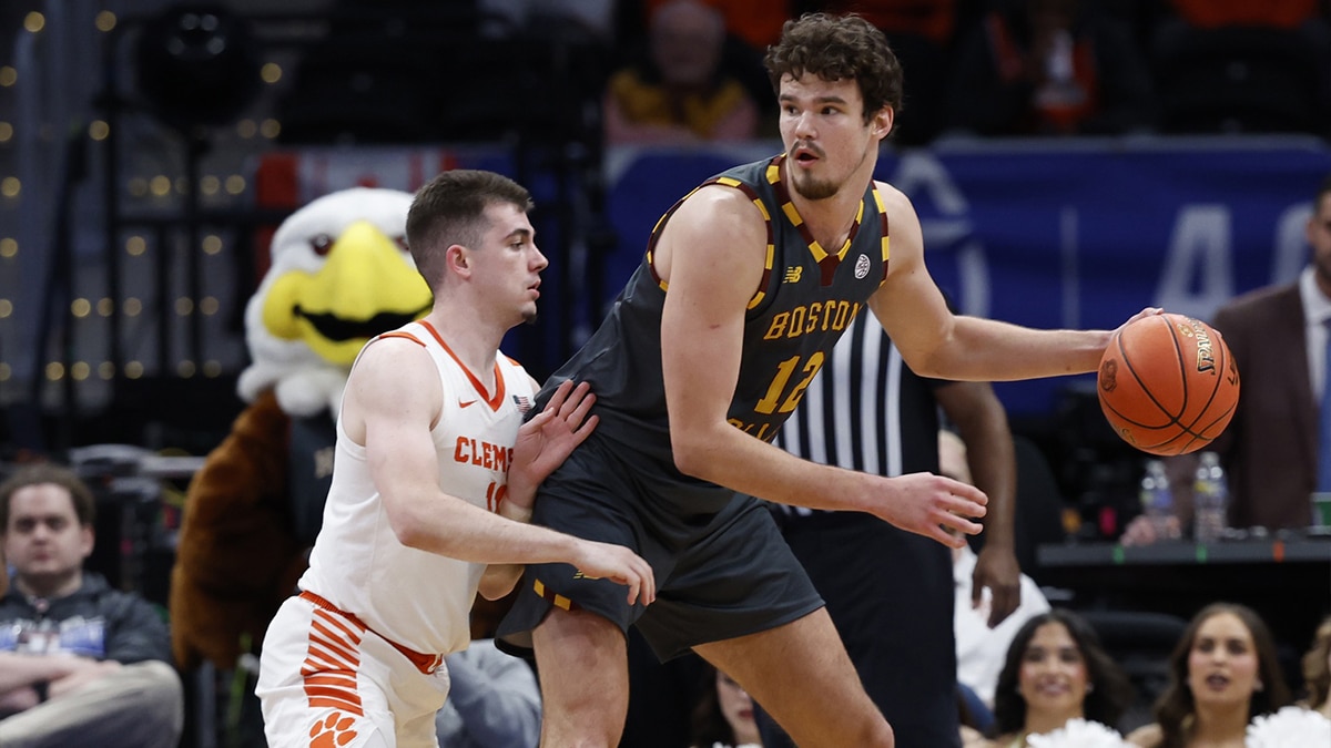 Boston College Eagles forward Quinten Post (12) dribbles the ball as Clemson Tigers guard Joseph Girard III (11) defends in the second half at Capital One Arena.