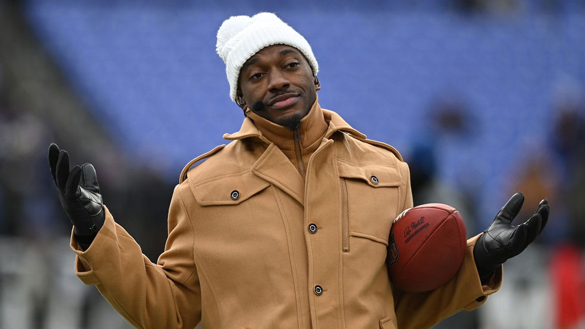 ESPN college football and NFL analyst Robert Griffin III reacts on the sidelines before a 2024 AFC divisional round game between the Houston Texans and the Baltimore Ravens at M&T Bank Stadium.