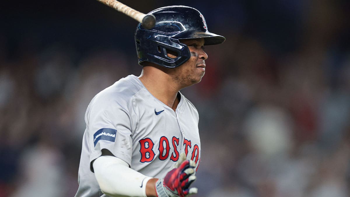 Boston Red Sox third baseman Rafael Devers (11) reacts after his solo home run during the ninth inning against the New York Yankees at Yankee Stadium.