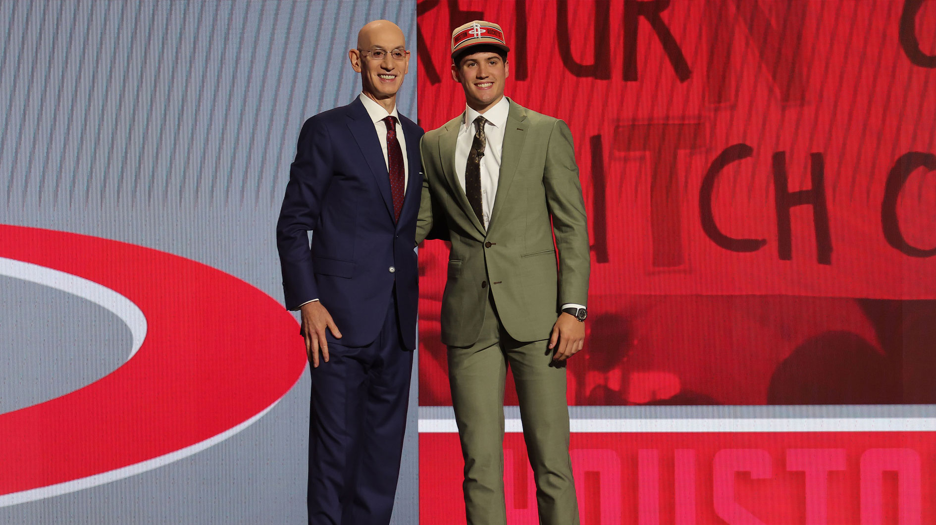 Reed Sheppard poses for photos with NBA commissioner Adam Silver after being selected in the first round by the Houston Rockets in the 2024 NBA Draft at Barclays Center.