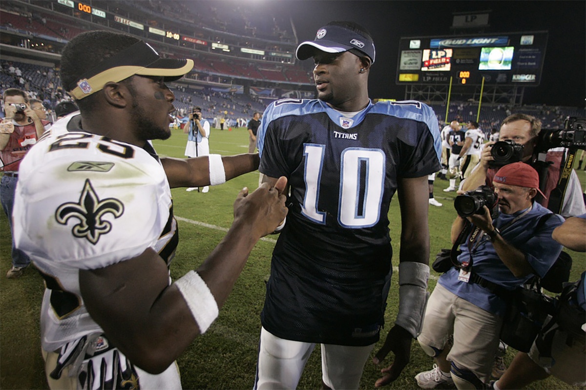 New Orleans Saints running back Reggie Bush (25) greets Tennessee Titans quarterback Vince Young (10) after the Saints defeated the Titans 19-16 at the LP Field.