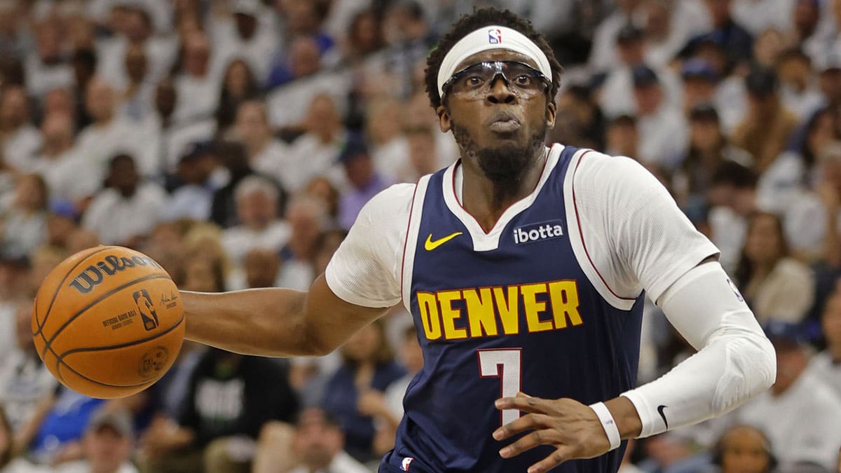 Denver Nuggets guard Reggie Jackson (7) goes to the basket against the Minnesota Timberwolves in the first quarter of game four of the second round for the 2024 NBA playoffs at Target Center.