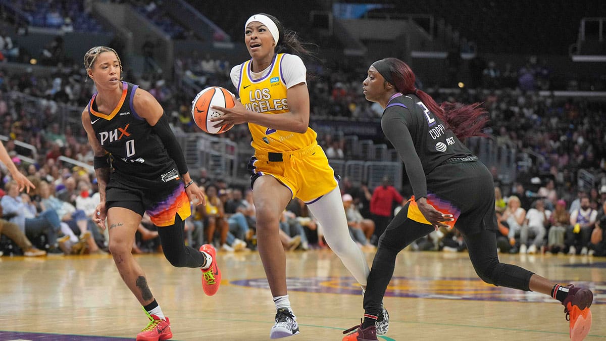 LA Sparks forward Rickea Jackson (2) dribbles against Phoenix Mercury guard Sug Sutton (1) and guard Kahleah Copper (2) in the second half at Crypto.com Arena.