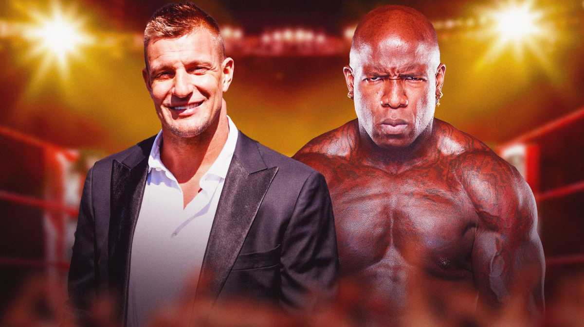 Rob Gronkowski next to TNA's Moose inside a wrestling ring.