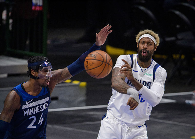 Minnesota Timberwolves forward Rondae Hollis-Jefferson (24) and Dallas Mavericks forward James Johnson (16) in action during the game between the Dallas Mavericks and the Minnesota Timberwolves at the American Airlines Center