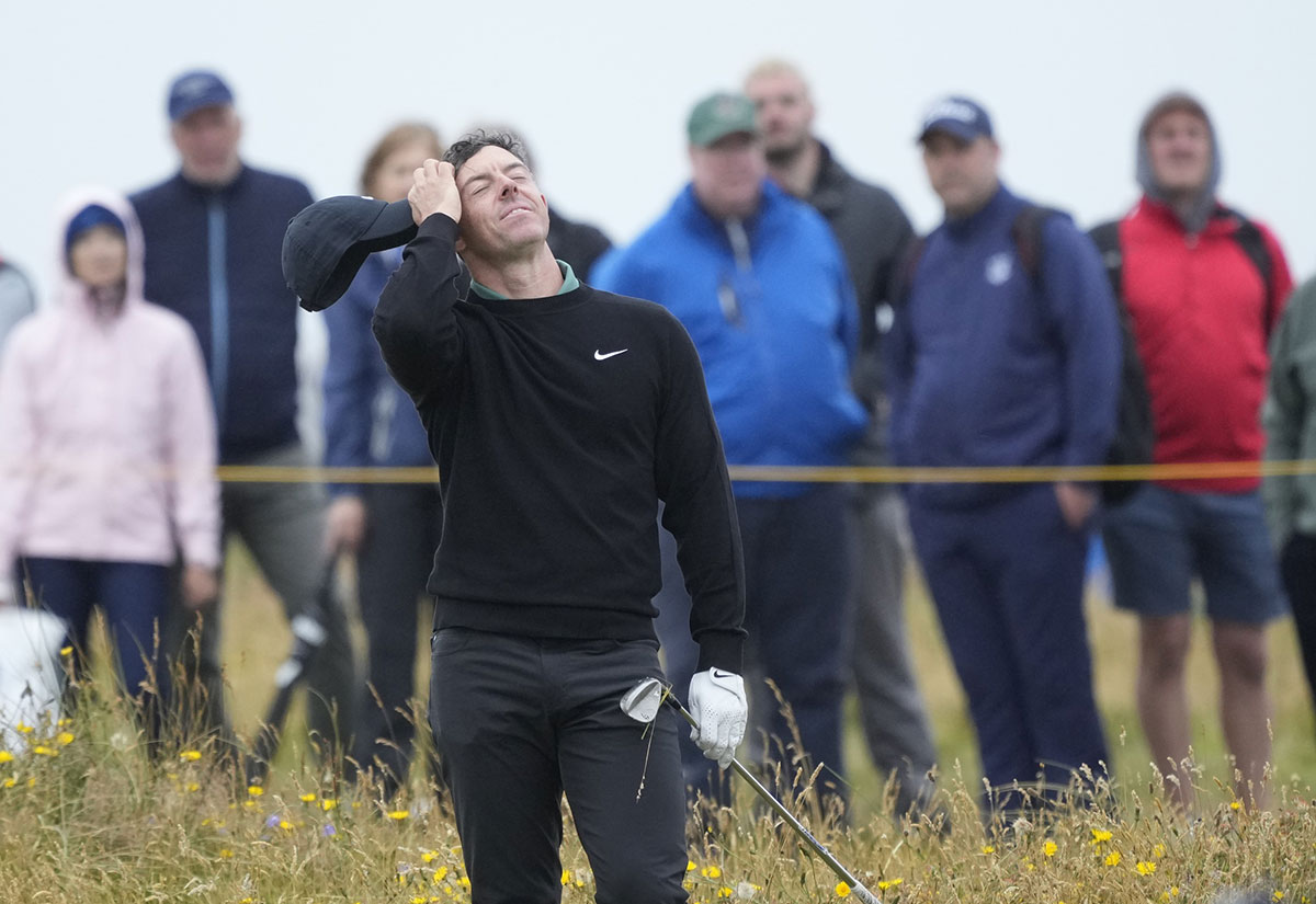 Rory McIlroy reacts after hitting from the rough on the 15th hole during the first round of the Open Championship golf tournament at Royal Troon. Mandatory Credit: Jack Gruber-USA TODAY Sports